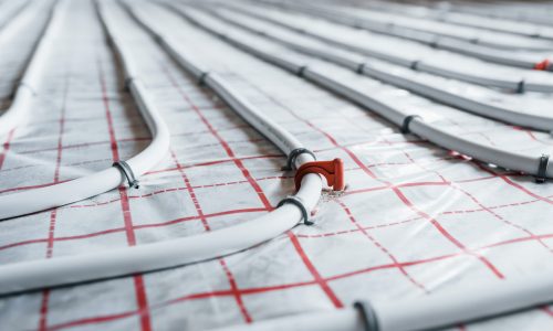 Pipes of underfloor heating system. Close up view. No people.